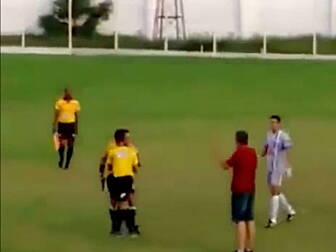 Referee pulls out a gun during...